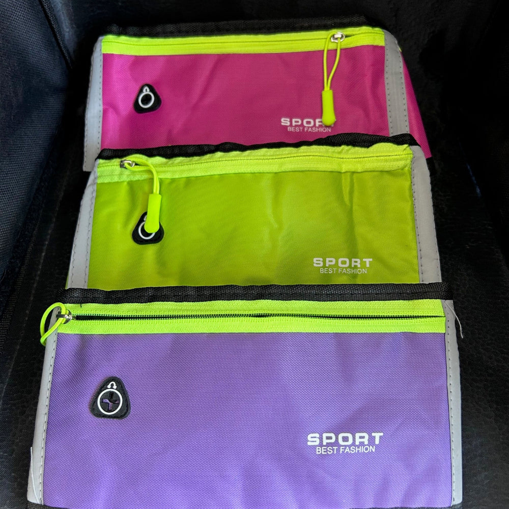 Three colorful waist bags with 'SPORT' branding on a dark surface.