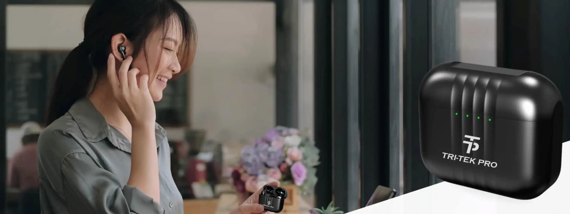 Woman using earbuds with a Tri-Tek Pro device displayed in the foreground.